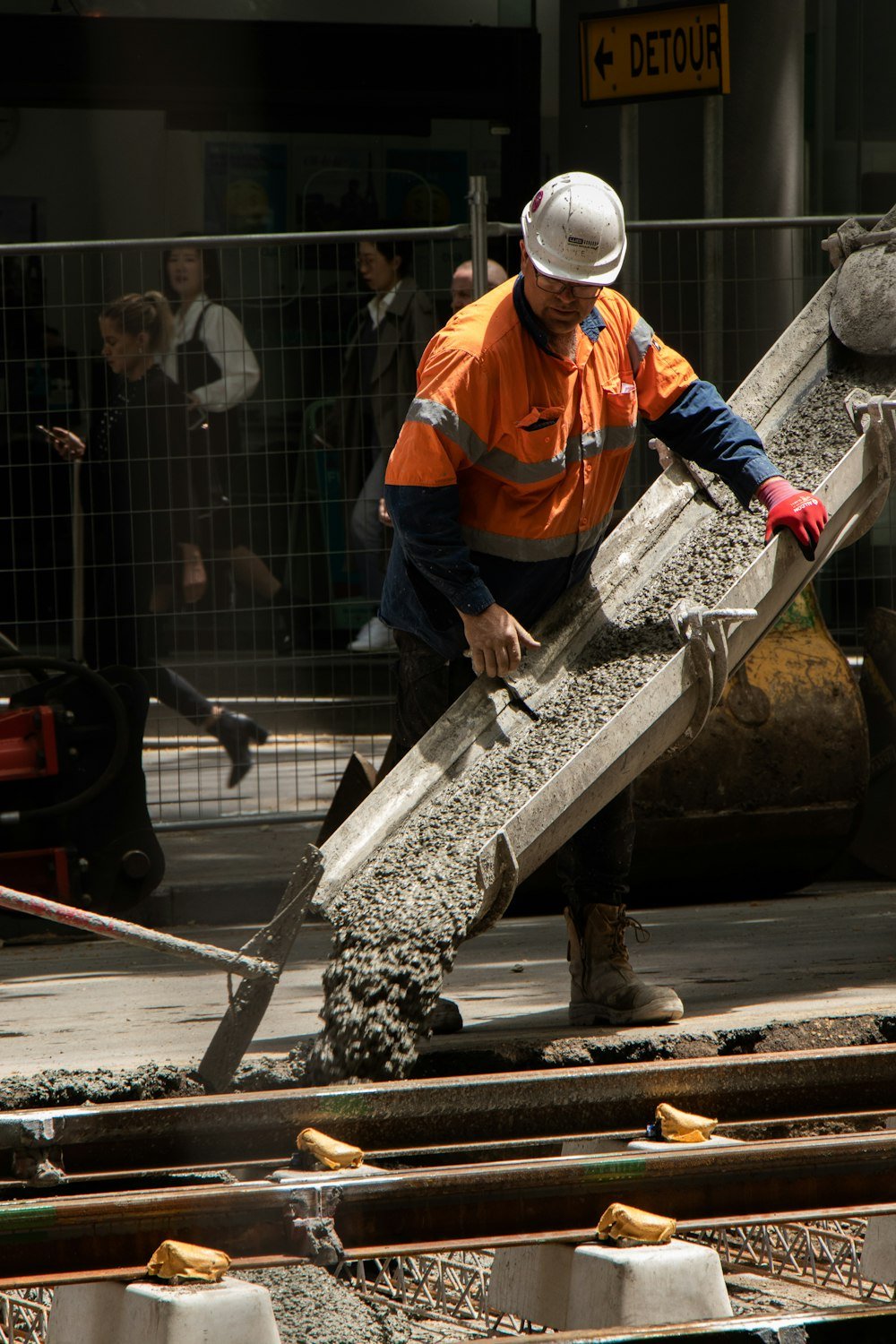 worker pouring concrete
